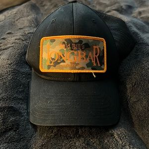 Wild bills long bar Hat. All black with cameo and orange lettering. Snap back.